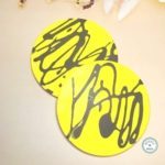 round coaster yellow dark green splatter pattern